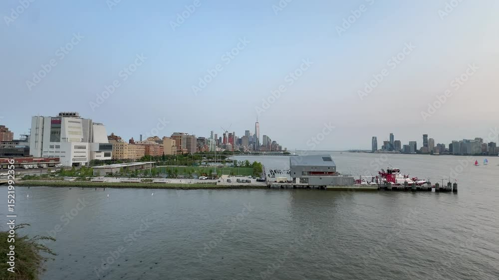 Scenic panoramic Hudson River vista at sunset with downtown Manhattan and Jersey City in the background, New York City Scenic panoramic Hudson River vista at sunset with downtown Manhattan and Jersey City in the background, New York City