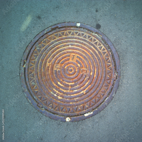Old Rusty Cast Iron Manhole Cover, Urban Texture