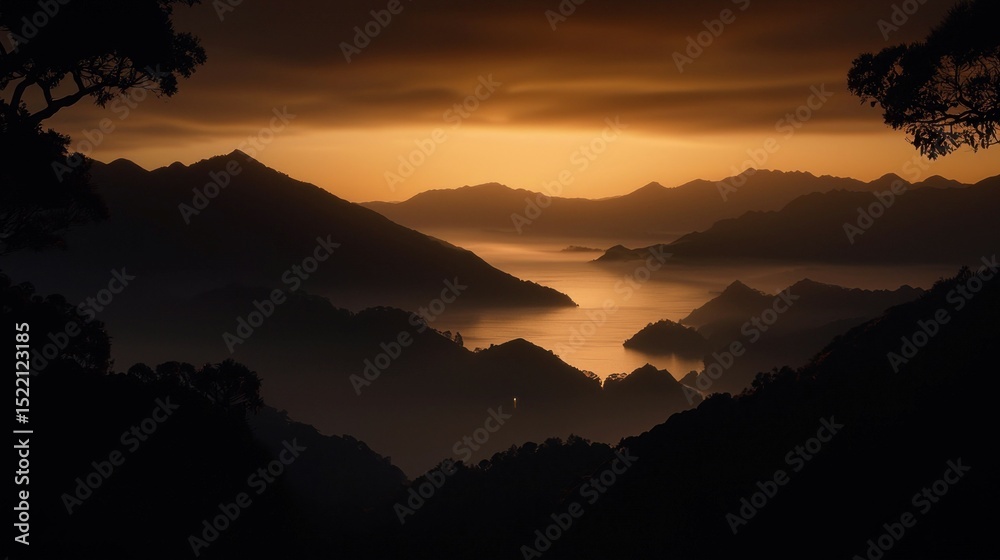 Obraz premium A scenic mountain range view during sunset with lake reflection