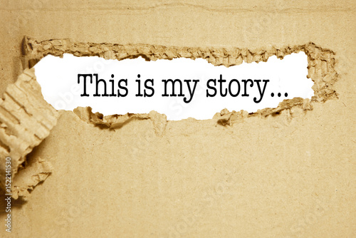 The words this is my story The text is hidden behind torn brown paper.