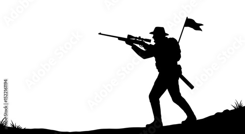 Silhouette of soldier carrying rifle and flag on hillside  