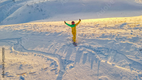 A snowboarding girl on a mountainside