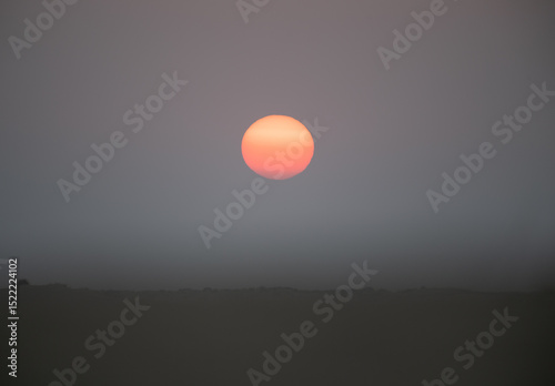 Hot desert sun going down in Dubai
