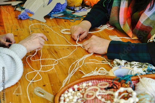 Master class on needlework from threads. Selective focus.