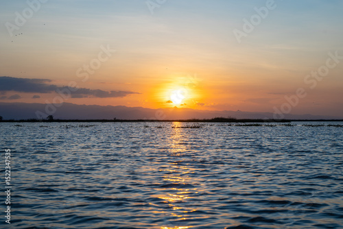 Sunset over Lake Tempe in Sulawesi, Indonesia's peaceful waters