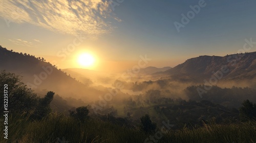The sky is a mix of gold and blue as the sun rises over a mountain. It's a stunning view with fog over the hills in the morning.
