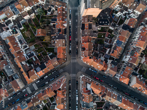 Top down aerial view of houses, gardens, streets and crossroad shaped like a plane in Brussels, Belgium photo