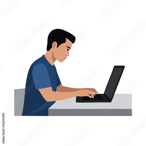 Young man working on laptop computer at desk