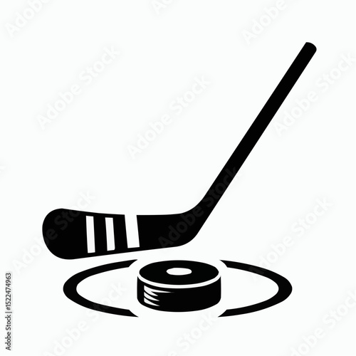Isolated wooden hockey stick and black puck, essential equipment for ice hockey