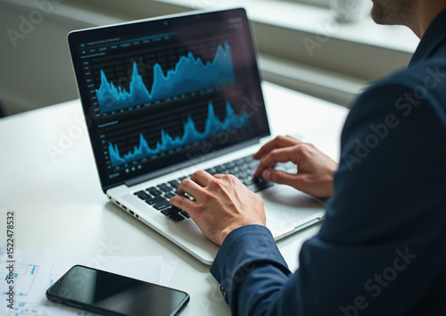 Man using laptop computer. Business analyst working on financial report and investment project, company performance data dashboard on screen, closeup