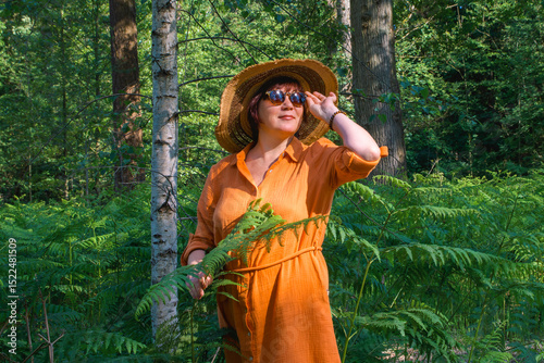 Woman on vacation in summer forest - portrait