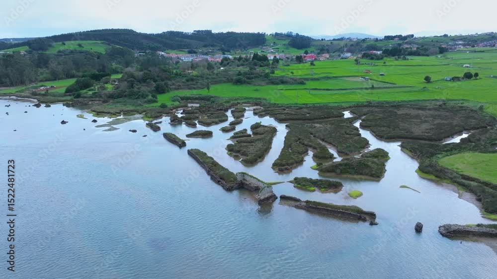 Tidal mill and marsh in the Mogro estuary in the municipality of Miengo. Liencres Natural Park. Costa Quebrada Geopark, Cantabrian Sea, Cantabria, Spain, Europe