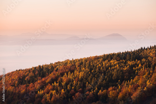Morning mood over a foggy autumn landcape in the mountains