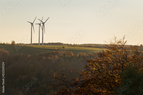 Wind power plants at sunset