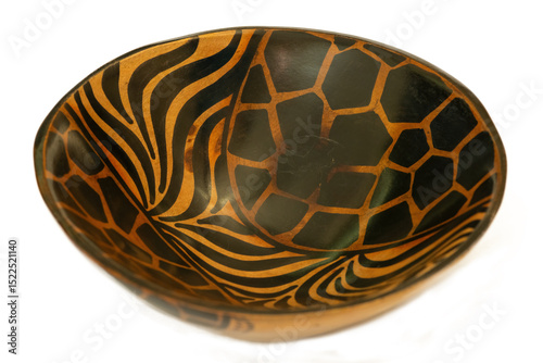 A traditional African hand-carved wooden bowl isolated against a white background