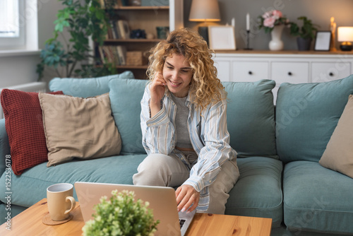 Young woman talking on video call with her psychotherapist doctor after online therapy sessions, happy that she is well and mentally health now after telemedicine conversations. Thank you for help