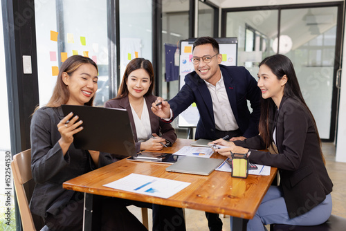 Group of Asian business working plan analysis project brainstorm in modern office, Asian businesspeople team working together, Business startup and company strategy planning concept.
