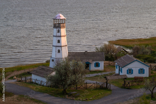 Old lighthouse on the shore of the Azov sea on a May evening. Rostov region, Russia