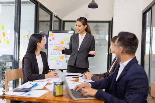 Group of Asian business working with analysis project brainstorm in modern office, Asian businesspeople team working together, Business startup and company strategy planning concept.