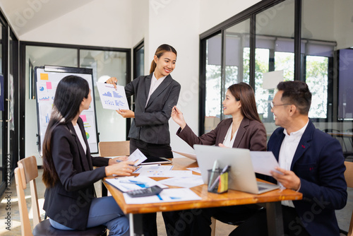 Group of Asian business working with analysis project brainstorm in modern office, Asian businesspeople team working together, Business startup and company strategy planning concept.
