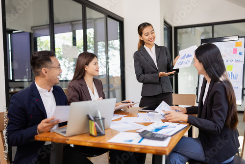 Group of Asian business working with analysis project brainstorm in modern office, Asian businesspeople team working together, Business startup and company strategy planning concept.