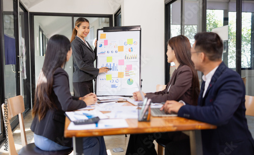 Group of Asian business working with analysis project brainstorm in modern office, Asian businesspeople team working together, Business startup and company strategy planning concept.