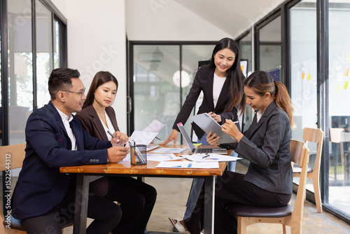 Group of Asian business working with analysis project brainstorm in modern office, Asian businesspeople team working together, Business startup and company strategy planning concept.