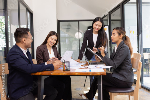 Group of Asian business working with analysis project brainstorm in modern office, Asian businesspeople team working together, Business startup and company strategy planning concept.