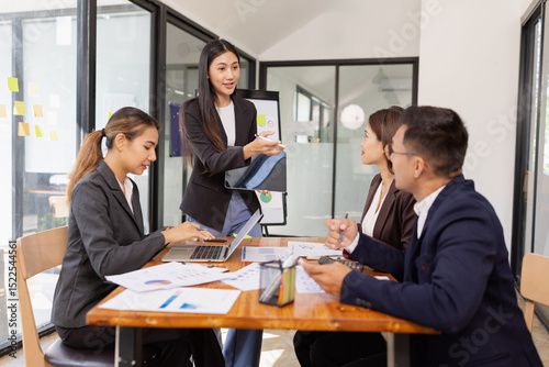 Group of Asian business working with analysis project brainstorm in modern office, Asian businesspeople team working together, Business startup and company strategy planning concept.