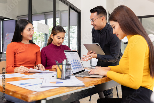 Group of Asian business working analysis project brainstorm in modern office, Asian businesspeople team working together, Business startup and company strategy planning concept.