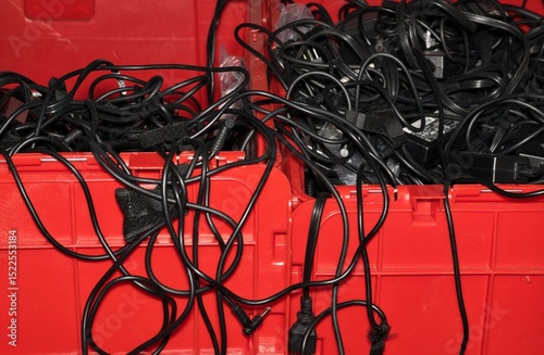 Electrical cord storage organizing plastic crate containers unused technology messy space saving.