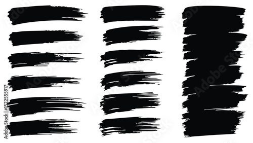 A set of black brush strokes in varying lengths and densities on a white background in a studio shot