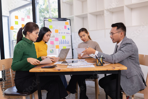 Group of business people working together with dashboard analysis and data management in conference room, Corporate business and dashboard to presentation concept.