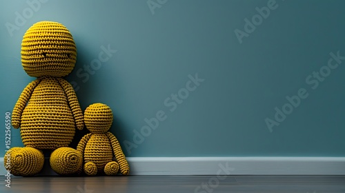 Yellow Crochet Dolls Standing Against a Soft Blue Wall in Minimalist Interior Design Setting
