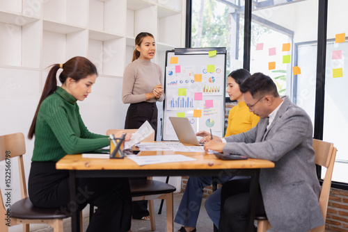 Group of business people working together with dashboard analysis and data management in conference room, Corporate business and dashboard to presentation concept.