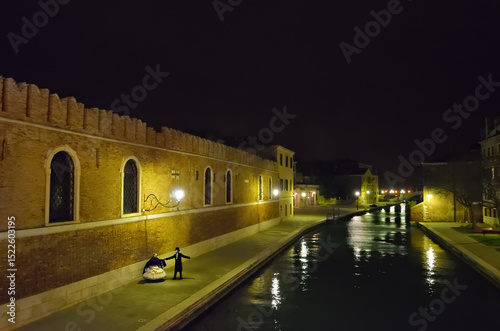Venice night street scene during annual carnival, Italy