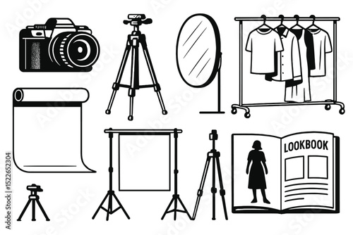 Studio setup for a fashion lookbook photoshoot with various equipment and clothing displayed