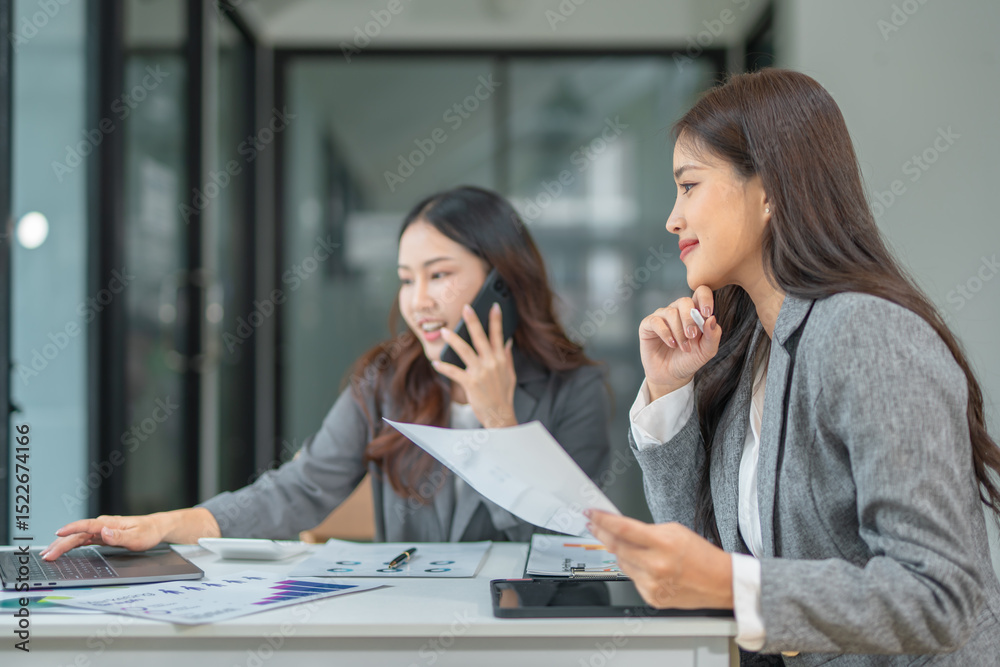 Two businesswoman hands or accountants working together on financial investment on calculator, calculating, analyzing business growth and marketing on graph. Two businesswoman hands or accountants working together on financial investment on calculator, calculating, analyzing business growth and marketing on graph.