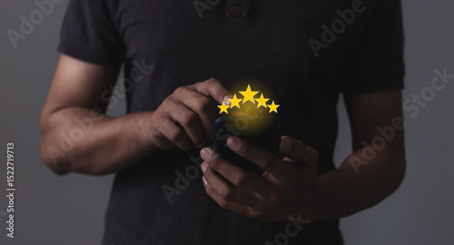 Review Customer, Young Man hand using smartphone mobile with five star to review and give 5 stars with very good results in service, Good review 5 star rating choice feedback