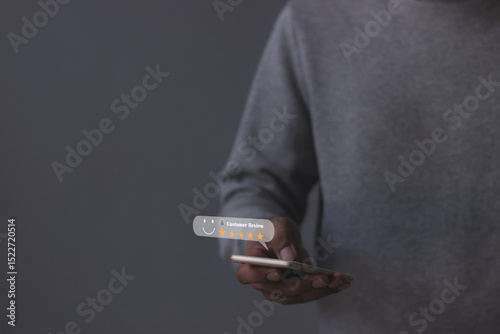 Review Customer, Young Man hand using smartphone mobile with five star to review and give 5 stars with very good results in service, Good review 5 star rating choice feedback