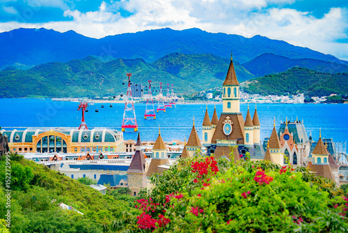 An island with an amusement park. 
View from the island towards the mainland. Nha Trang Vinwonders Amusement Park. The cable car is 3 kilometers above sea level, leading to the island. 
