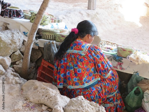 Фотография traditional mexican indigenous Tarahumara woman in a traditional dress in Creel,