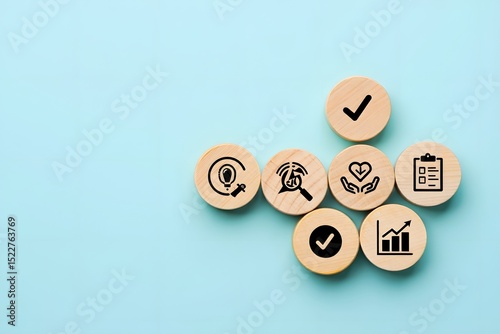 Business & Insurance Concept Icons on Wooden Tokens – Flat Lay on Mint Background

