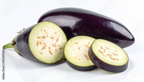 the photograph features a arrangement of produce placed on a plain white surface. a whole specimen with a smooth, dark outer skin lies behind, its oblong shape clearly visible