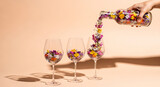 Pouring wildflowers into wine glasses: a summer still life