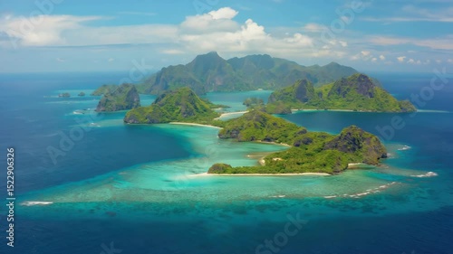 Breathtaking view of Fijian islands with lush vegetation, white sand beaches and crystal clear waters.