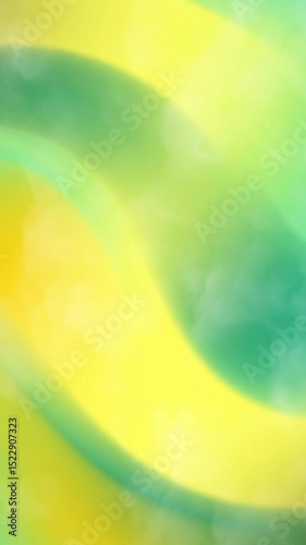 Blurred yellow and green abstract background with smoke effect suitable for presentations, websites, social media graphics, print materials, and artistic projects.
