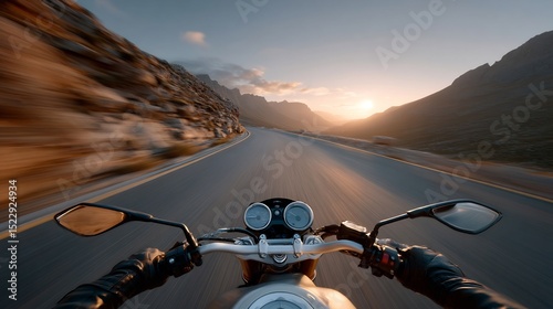 A motorcycle ride on a winding mountain road at sunset.