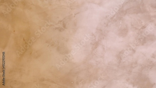 a close up view of an elegant textured marble wall surface with a subtle, warm beige tone.