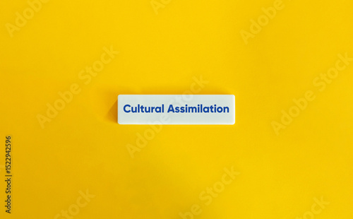 Canvastavla Cultural Assimilation Letter Tile on Yellow Background – Minimalist Social Integ